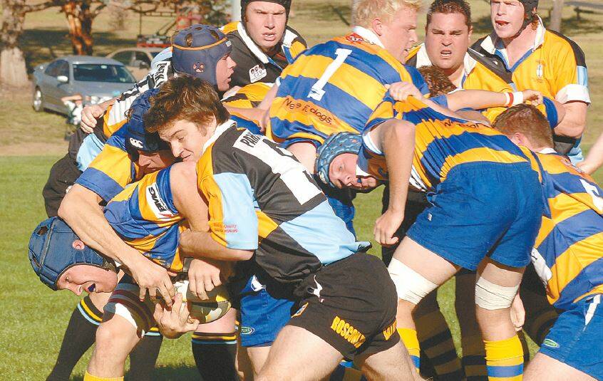 CLASSIC DERBY: Bulldogs captain Andrew Breen makes a trademark pick and drive, but he is halted by CSU scrumhalf Dan Grieves in this May 2007 derby.