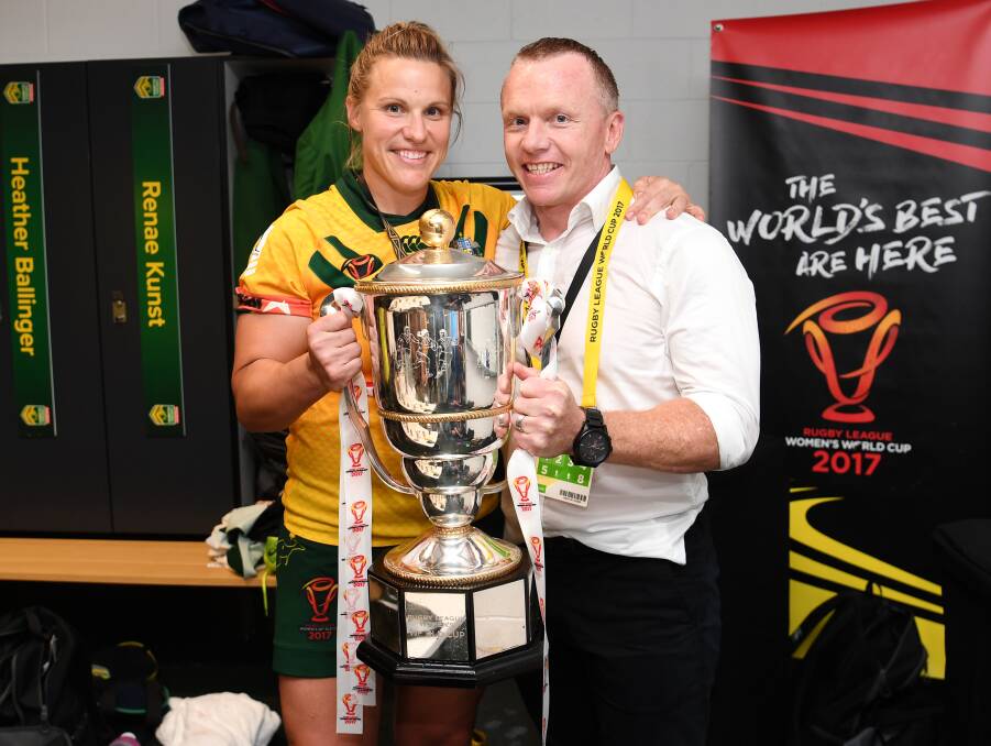 THE SPOILS: Jillaroos skipper Renae Kunst and coach Brad Donald - a former Bathurst Panther - hold the Women's Rugby League World Cup trophy. Photo: NRL PHOTOS