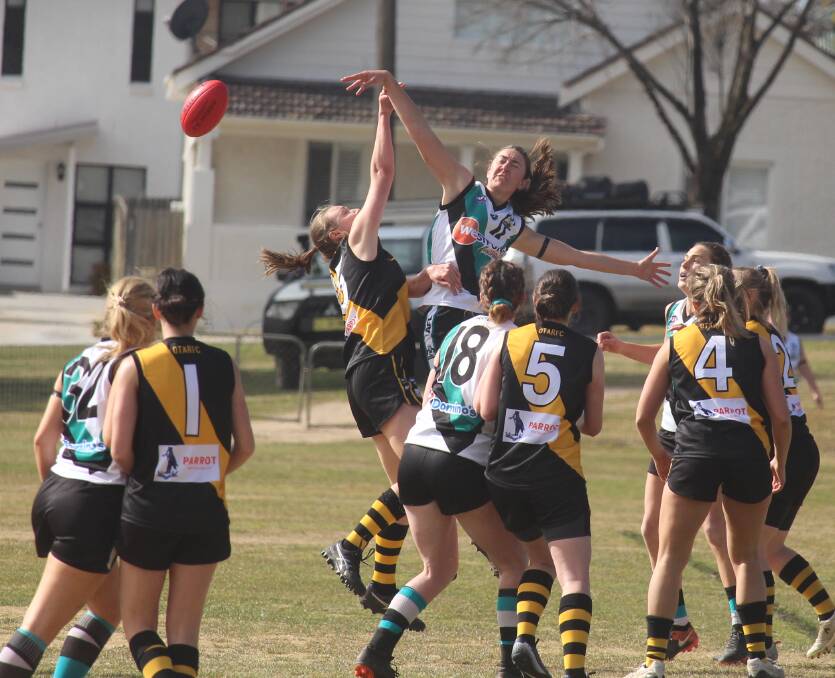 STAR PERFORMER: Beth Durham gets the better of this ruck contest against the Orange Tigers. It remains to be seen if she'll be back with the Lady Bushrangers next season. Photo: MAX STAINKAMPH