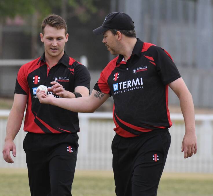 HE'S BACK: Ben Patterson talks tactics with fellow bowler Clint Moxon when he made a one-off appearance in the Bonnor Cup for Redbacks in 2019. Photo: JUDE KEOGH