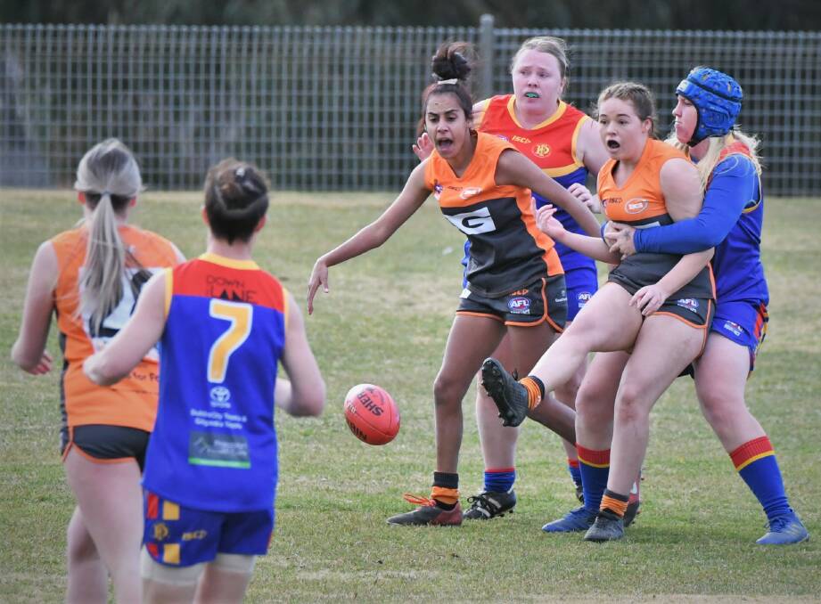 UPSET: Bathurst Giants' Brooke Wright gets boot to ball in her side's match against Dubbo on Saturday. It was a game the Demons won by 33 points. Photo: CHRIS SEABROOK 071622cwgiants8