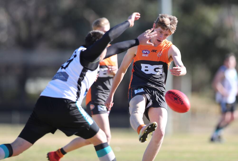 SINKING THE BOOT IN: The Bathurst Giants kicked seven majors in the opening quarter of their match against the Bushrangers Outlaws. Photo: PHIL BLATCH