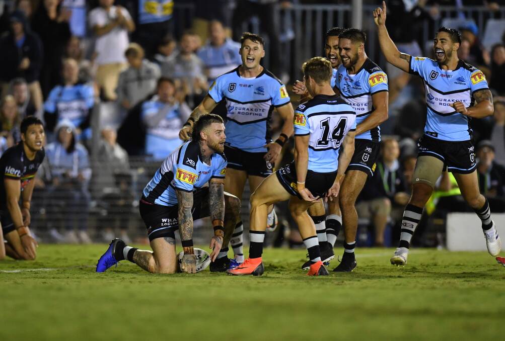YOU BEAUTY: William Kennedy junior celebrates with his Sharks team-mates after a Josh Dugan try on Thursday night. Photo: AAP