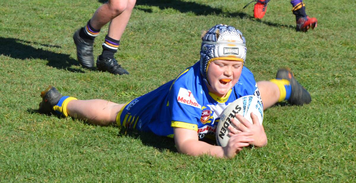 TIME TO CELEBRATE: Charlie Brown scores a try for the under 11 Eels. Eglinton is now asking all players to film and share their best post try celebrations. Photo: ANYA WHITELAW