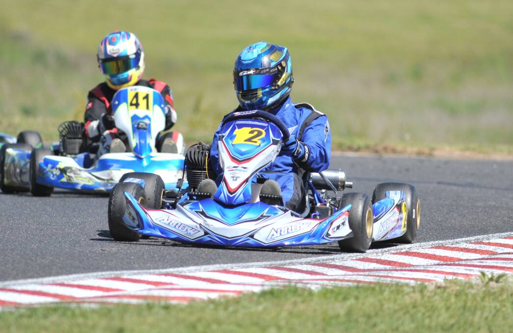 FULL NOISE: Jason Newman leads the way from Kody Garland to win the KA3 Senior Light title at the South Pacific kart titles in Orange on Saturday. Photo: JUDE KEOGH