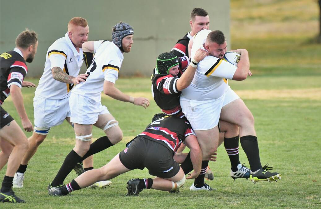 THE GRIND: Prop Marcus Burrell makes yards for CSU in their last meeting with Parkes at University Oval. Photo: PHIL BLATCH