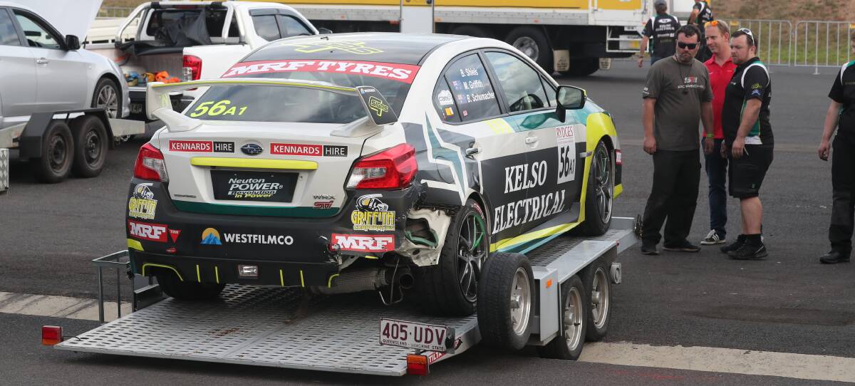 RACE OVER: The damaged Subaru of Brad Schumacher sits on a trailer in the back of the pits during the Bathurst 6 Hour. Photo: PHIL BLATCH