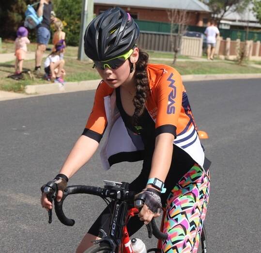 AUSTRALIA DAY RACING: A strong cycle leg helped Ebony Robinson to fifth place outright and second in her age division in the Bathurst Wallabies short course race on Sunday. Photo: CONTRIBUTED