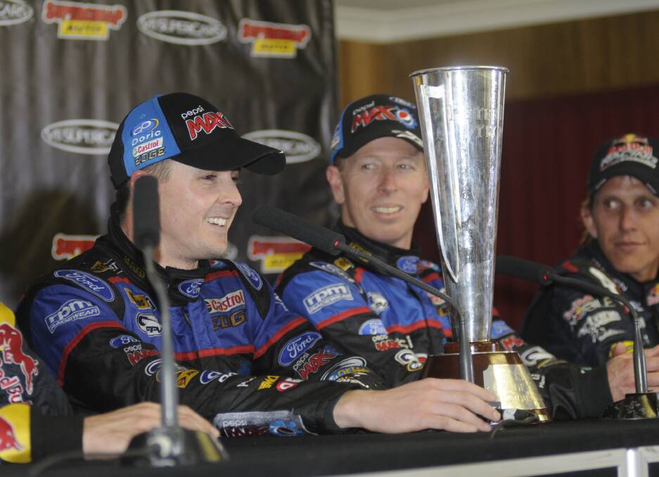 FLASHBACK: Mark Winterbottom and Steve Richards with the Peter Brock Trophy they won together in 2013. Photo: CHRIS SEABROOK