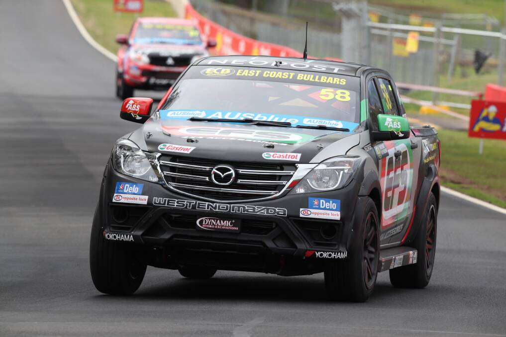 PULLING CLEAR: Ryal Harris drives away from Craig Dontas in race one of the SuperUtes' Bathurst round. Photo: PHIL BLATCH