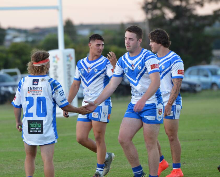 JOB WELL DONE: Cooper Nunan and Adam Booth give each other five after the Saints won their Western under 21s season opener. Photo: ANYA WHITELAW