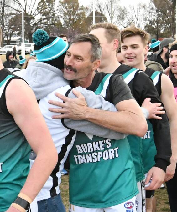 SPECIAL DAY: Mick Phillips was delighted to win a Central West AFL grand final alongside his sons Ben and Lachlan. Photo: CHRIS SEABROOK