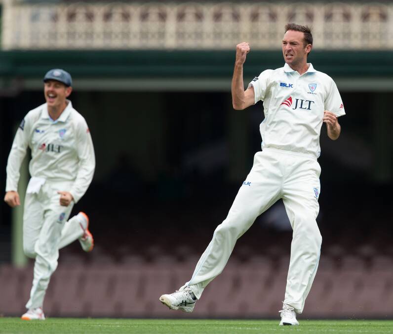 GOT HIM: Trent Copeland celebrates removing George Bailey with the first ball of day three in NSW's Sheffield Shield match against Tasmania. Photo: AAP