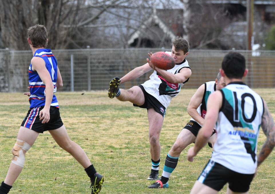 POWER SHOT: Bushrangers Rebels player Thomas Cook puts plenty of effort into this kick during Saturday's match against the Parkes Panthers. Photo: CHRIS SEABROOK 082518cafl3