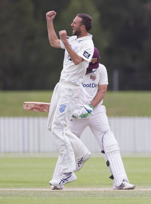 YES!: Trent Copeland celebrates taking one of his nine wickets in the shield match against Queensland. Photo: AAP
