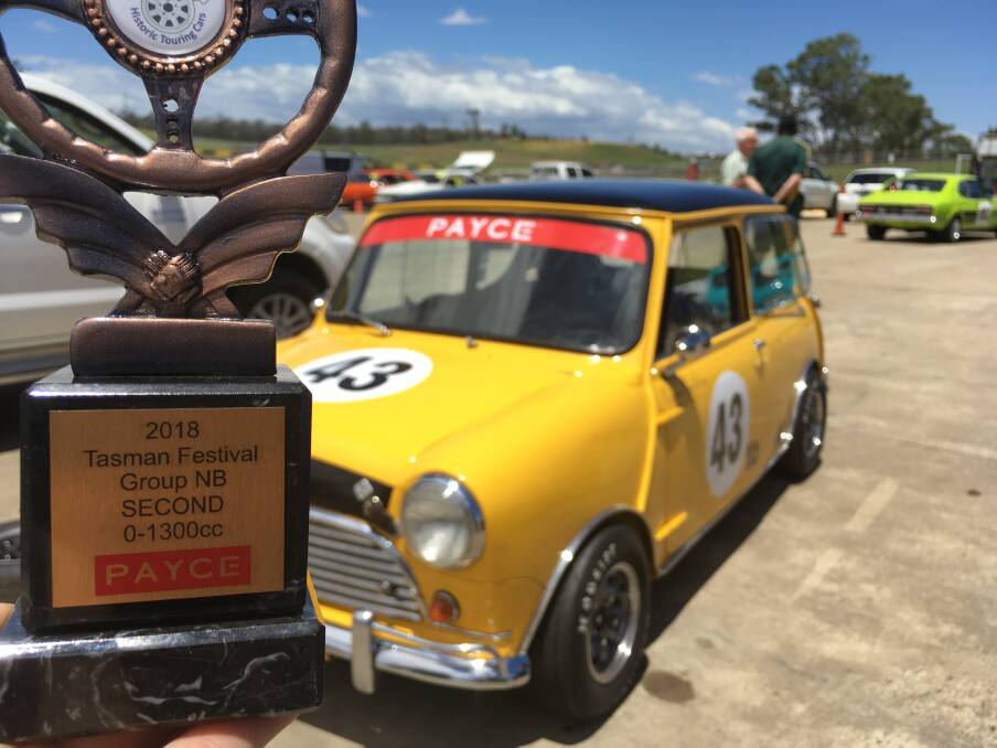 THE SPOILS: Nathan Goulding earned his first motor sport trophy on Sunday at Sydney Motor Sport Park. Photo: CONTRIBUTED