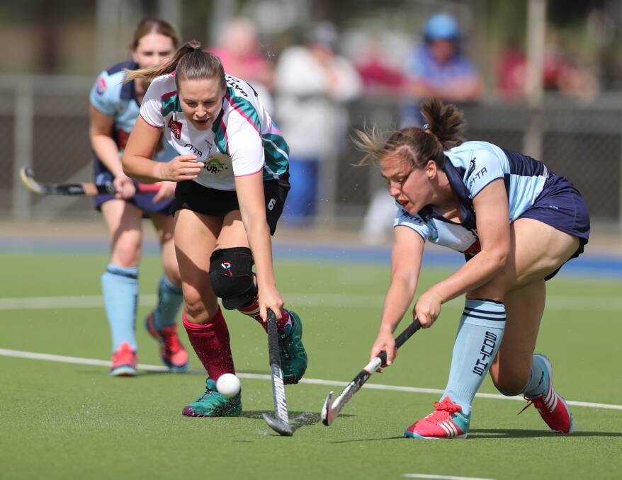 STAND OUT: Daisy Morrissey, pictured clearing the ball away from Bathurst City striker Bec Bosianek, was brilliant in defence for Souths. The two blues won the season opener 1-0. Photo: PHIL BLATCH