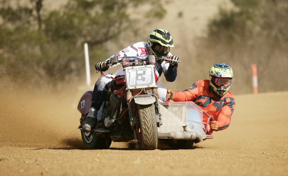 DIRT FLIES: Bathurst's Shadows Sidecar Racing duo Sean Griffiths and Mick Bryant in action at Bega. Photo: OWEN BERRIDGE