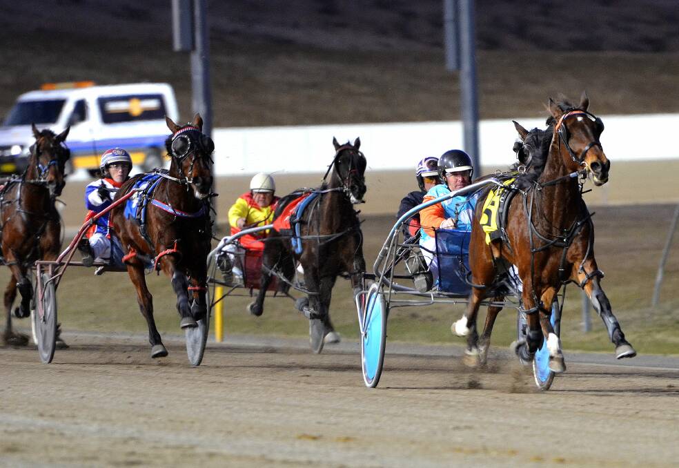 GOODBYE: Switchem All In, with Brett Field in the gig, kicks away from his rivals at the Bathurst Paceway on Wednesday. Photo: ANYA WHITELAW