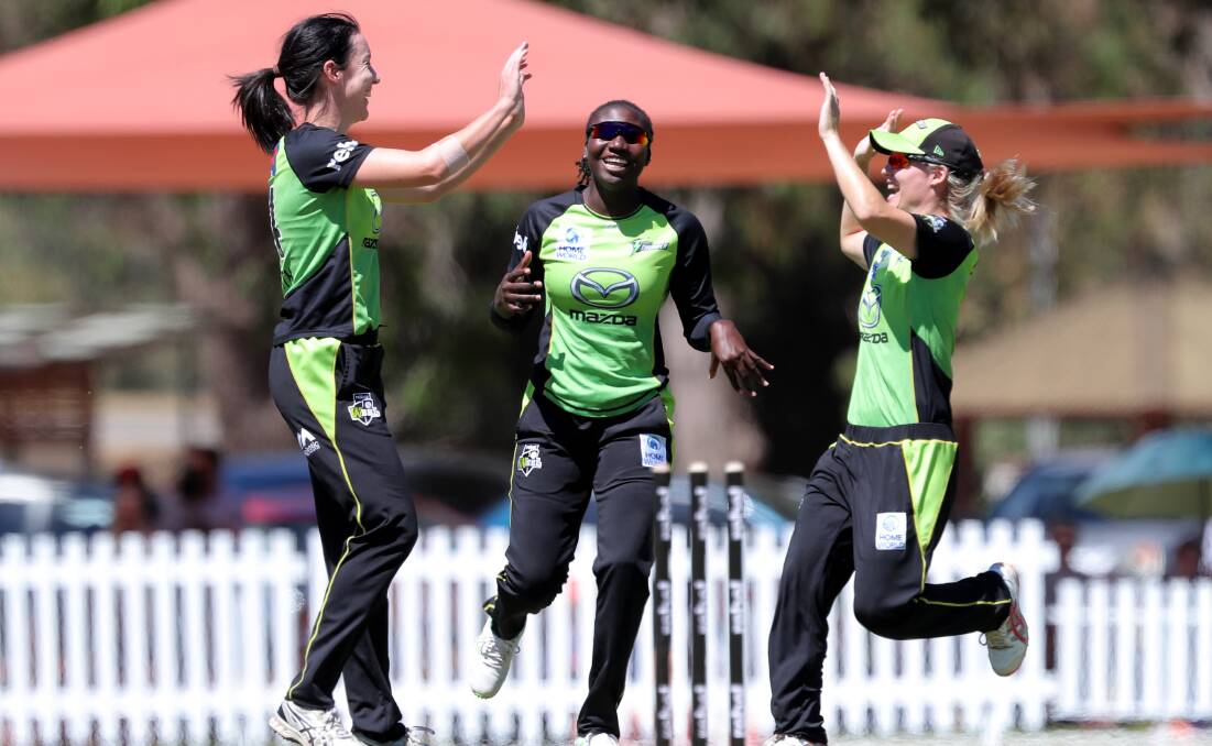 HIGHLIGHT: Lisa Griffith celebrates with Stafanie Taylor and Nicola Carey after bowling Perth star Meg Lanning. Photo: AAP 
