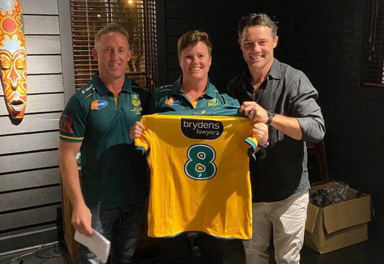 It was a proud moment for Marita Shoulders when NRL great Cooper Cronk (right) presented her with her Australian jumper alongside coach Gavin Lennon. Picture supplied
