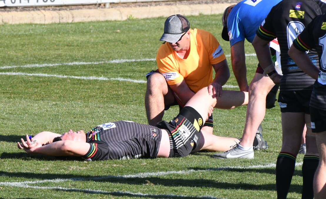 PAIN: Bathurst Panthers utility Josh Small receives attention to his knee during the premier league grand final. The injury is likely to rule him out of season 2020. Photo: CHRIS SEABROOK 