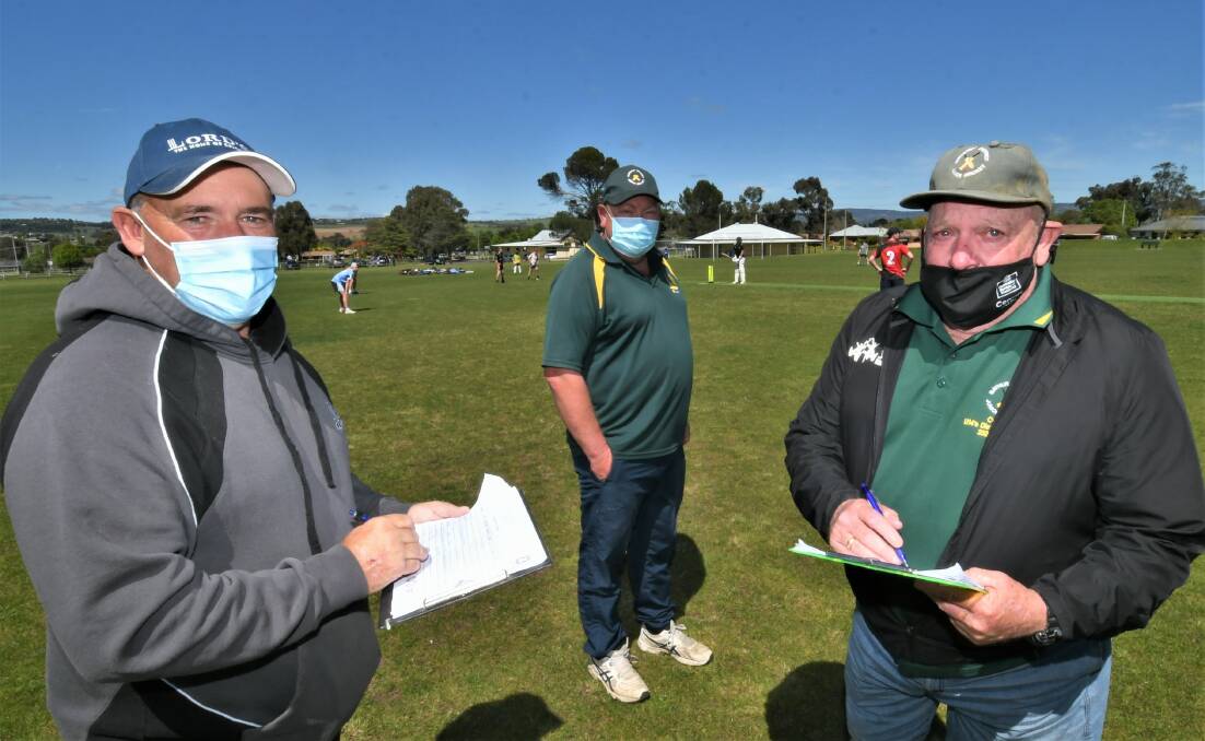 TALKING TEAMS: Selector Shane Broes, Bathurst District Junior Cricket Association president Steve Cain and under 16s coach Greg Innes cast their eye over the under 16s hopefuls at a selection trial on Sunday. Photo: CHRIS SEABROOK