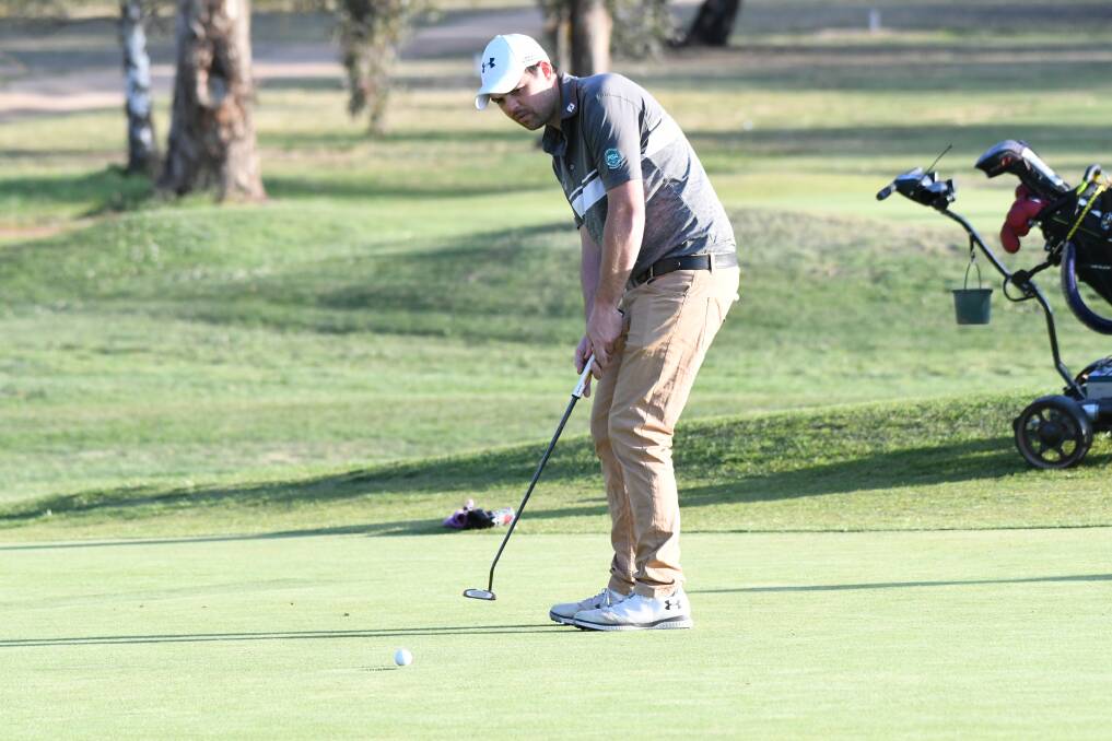 EYE ON THE CUP: Nathan King puts his putter to use during a recent round at the Bathurst Golf Club. Photo: CHRIS SEABROOK 