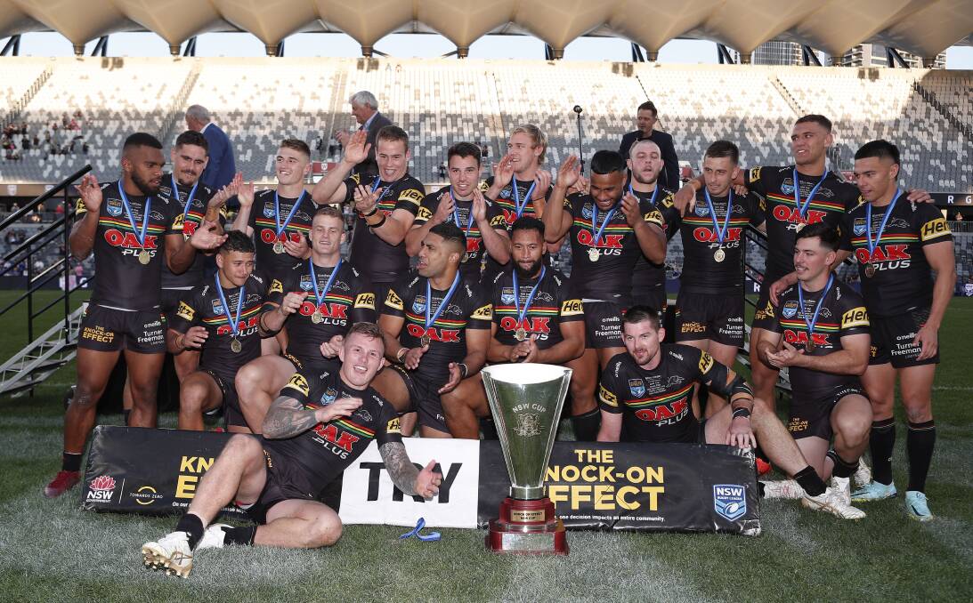 Liam Henry, back row fourth from left, celebrates with his fellow Panthers after their NSW Cup triumph. Picture by Bryden Sharp