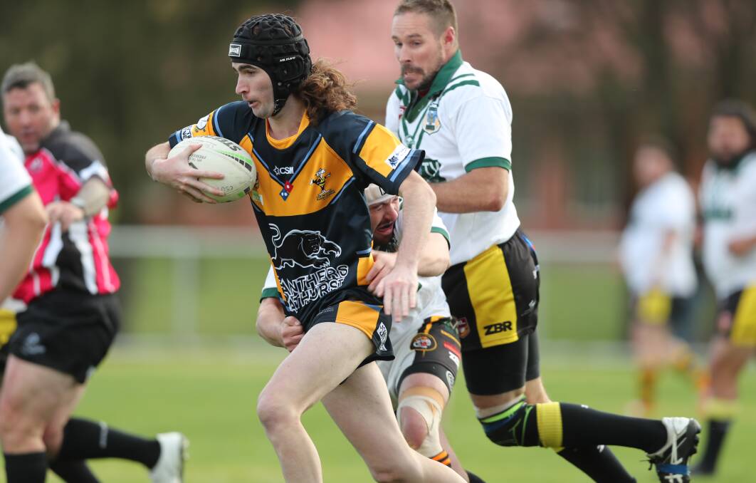 THEY'RE BACK: CSU's Joe Coady tries to slice through Portland's defence in a 2019 clash. While the Colts sat out 2020, they're now back on deck. Photo: PHIL BLATCH