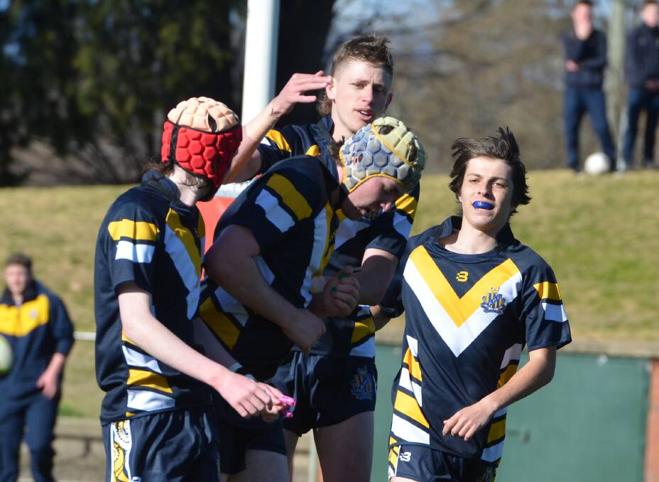 WELL DONE: Bathurst High prop Will Cuthill is congratulated after scoring the opening try. Photo: ANYA WHITELAW