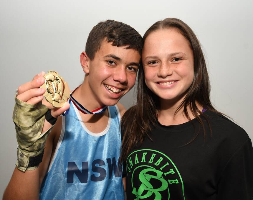 READY TO GO: Kate Fallon, pictured with fellow Bathurst boxer Tyson Keogh, will face a Queensland opponent at the Christmas Party Fight Night on Saturday. Photo: CHRIS SEABROOK