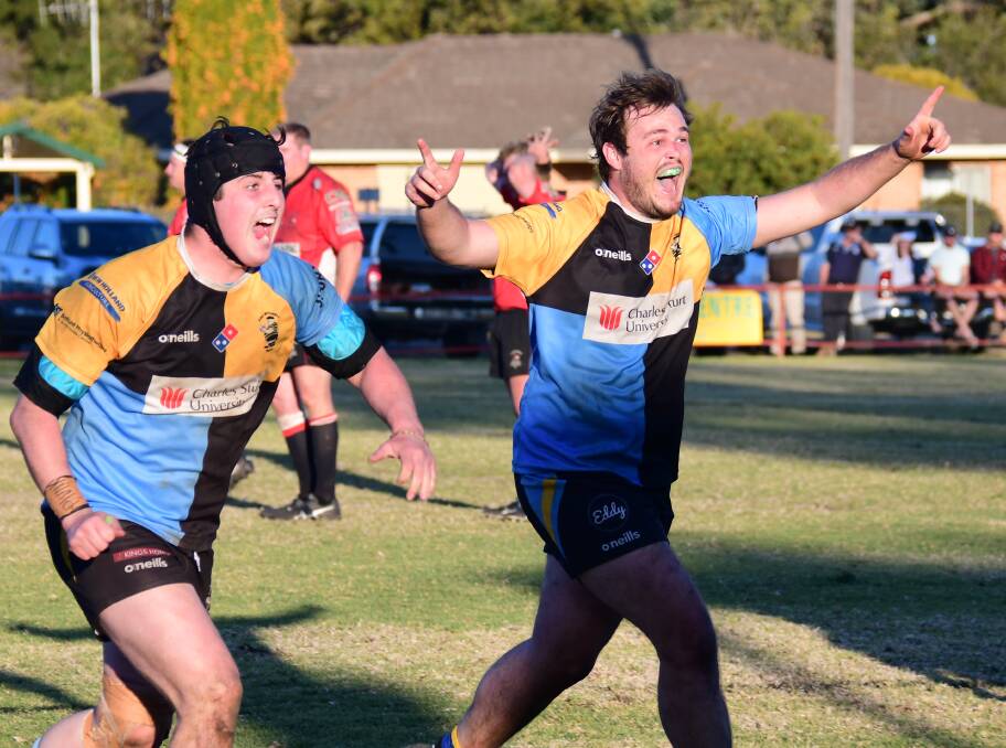 MOMENT OF TRIUMPH: Jack Keppel celebrates after booting the match-winning penalty goal for CSU in this year's grand final. Photo: AMY McINTYRE