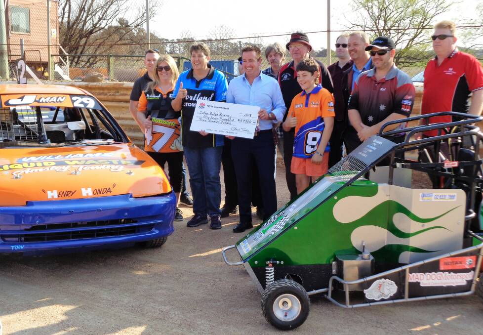 DELIGHTED: Members of the Portland District Motor Sports Club with Bathurst Member of Parliament Paul Toole after a funding upgrade for the Cullen Bullen Raceway was announced.