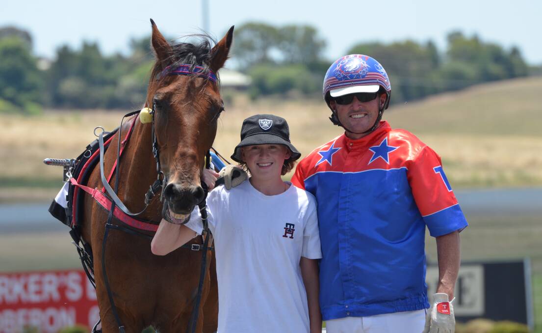 Jett Turnbull was delighted when the first horse he owns outright, Harry Croft, won with his father Nathan Turnbull in the gig. Picture by Anya Whitelaw