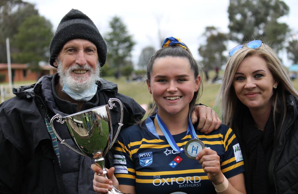 PROUD DAY: Amber Hanrahan with her Grandfather Alan Harvey and Mum Tamar Harvey after Saturday's grand final win. Photo: JOHN FITZGERALD