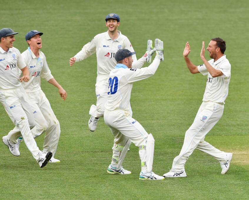 YOU BEAUTY: Trent Copeland celebrates taking one is his nine wickets in NSW's Sheffield Shield opener against South Australia. He also scored a half century for the Blues. Photo: AAP