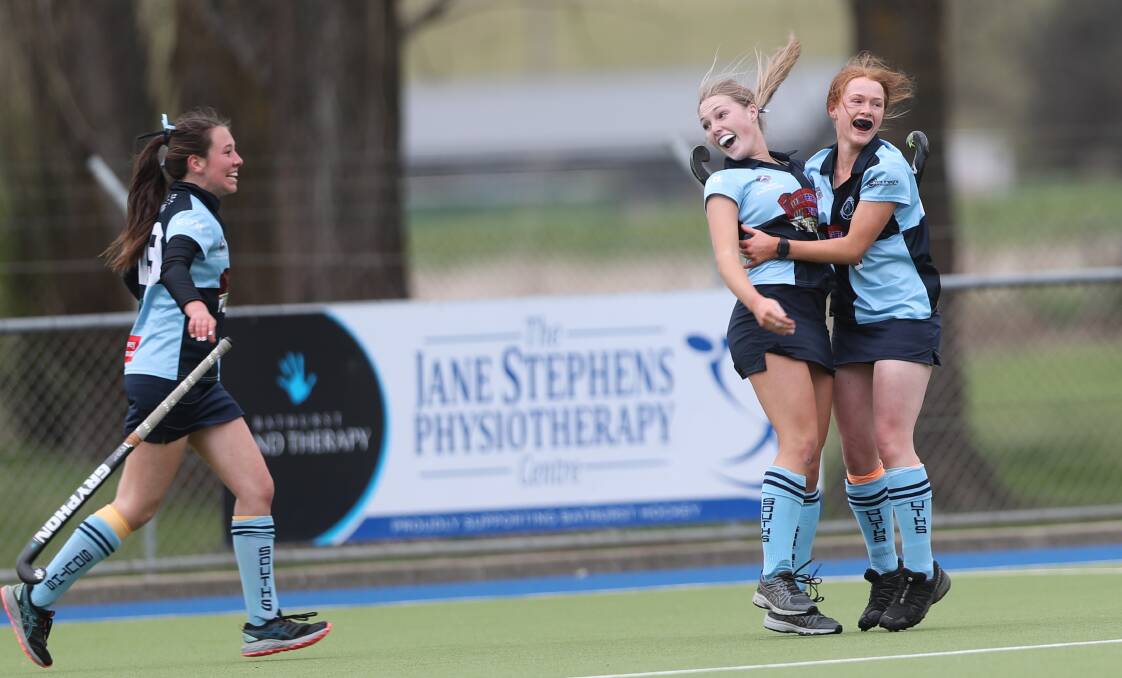 Sam Brown and team-mate Clare Mawhood celebrate her winning goal in Saturday's grand final. Picture by Phil Blatch