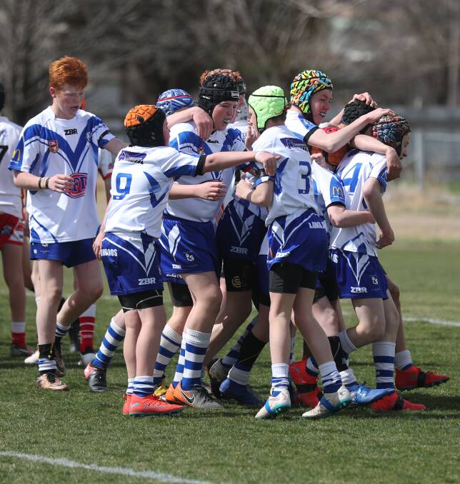 BANNED?: The under 13 Saints celebrate after a try in the 2019 grand final, but this sort of scene may be prohibited in 2020. Photo: PHIL BLATCH 