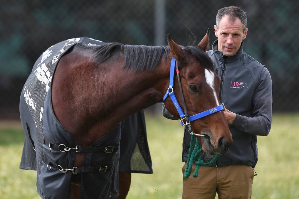 CUP HOPEFUL: Trainer Iain Jardine with Nakeeta - the Melbourne Cup contender which Bathurst's Stacey and Mick Whittaker own a share in. Photo: AAP