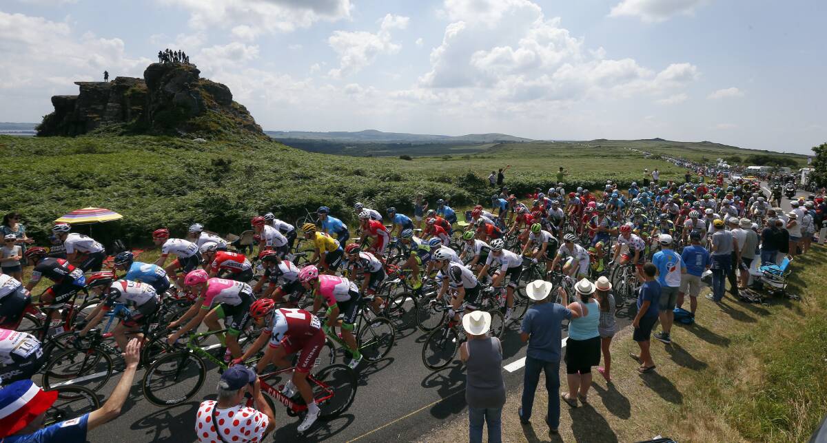 MOVING RIGHT ALONG: The peloton works on some of the flatter roads before the finish of the Tour de France's sixth stage. Photo: AP