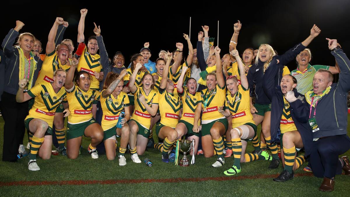 VICTORY: Brad Donald (right) celebrates with his victorious Jillaroos. Photo: GETTY IMAGES