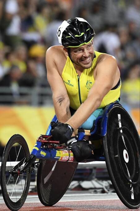 ANOTHER HONOUR: Carcoar's Kurt Fearnley, pictured after winning the men's 1,500 metres silver medal at the Commonwealth Games, has been named an Officer of the Order of Australia. Photo: AAP