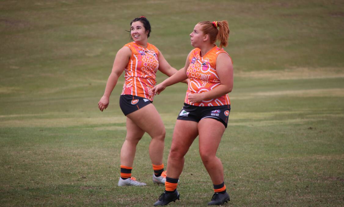 WATCHING IT FLY: Bathurst Giants' small forward Hailee Taylor, and her team-mates Elise Gullifer, watch on as a shot flies through for a major. Photo: CONTRIBUTED
