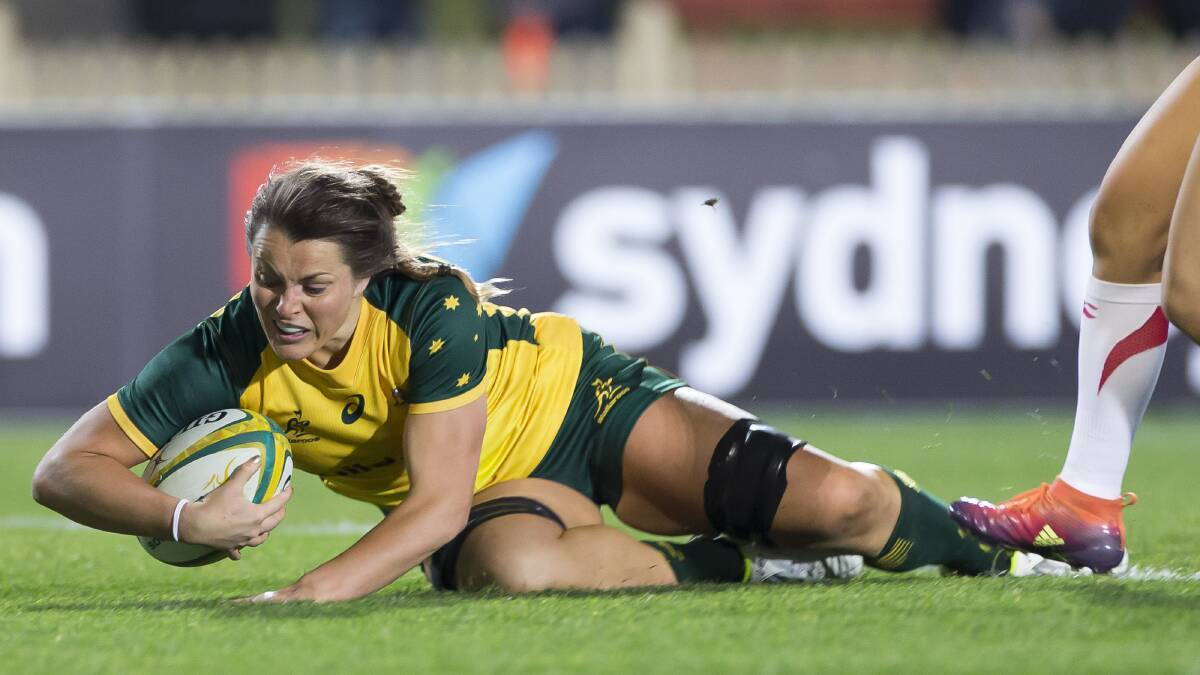 STEPPING UP: Grace Hamilton, pictured scoring one of her three tries in the Wallaroos' second Test win against Japan, has relished her leadership roles. Photo: AAP