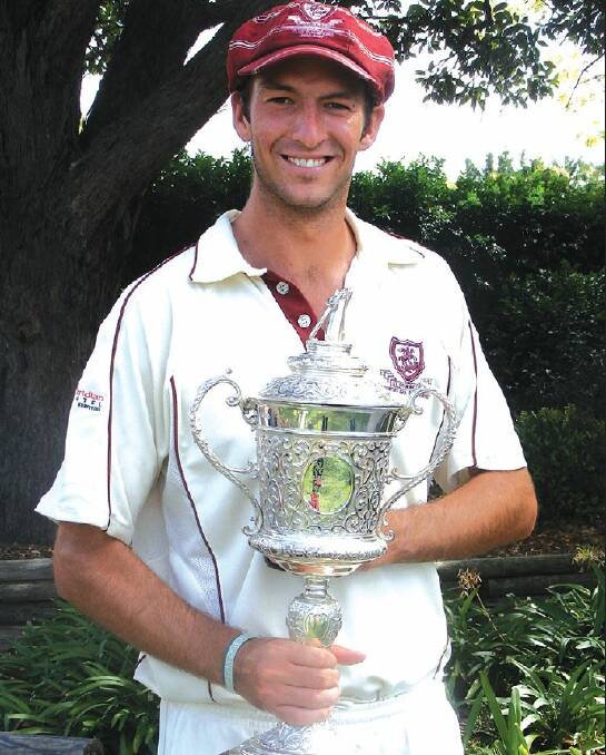 THE SPOILS: Trent Copeland poses with the first grade premiers' Belvidere Cup after the 2008-09 grand final.