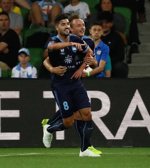 YOU BEAUTY: Rhyan Grant celebrates with Sydney FC Paulo Retre after the opening goal in Friday's 3-0 win over Melbourne City. Photo: AAP