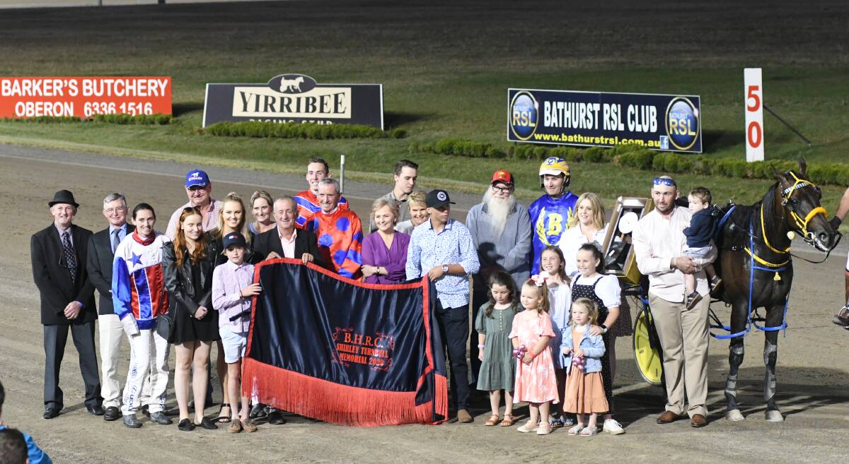THE WINNING SHOT: Members of the Turnbull family join the Frisbys and their supporters for a photo after the running of the 2020 Shirley Turnbull Memorial. Photo: CHRIS SEABROOK