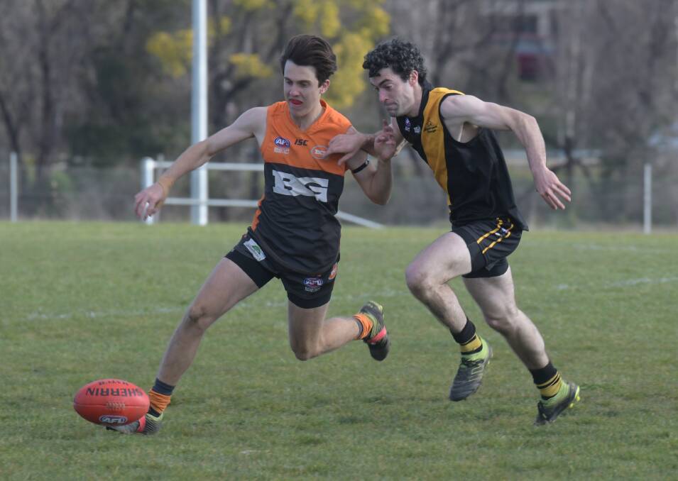 PURSUIT: Bathurst Giant Bailey Brien leads the race to the Sherrin against Orange Tiger Mick Evans in Saturday's penultimate round. Photo: JUDE KEOGH