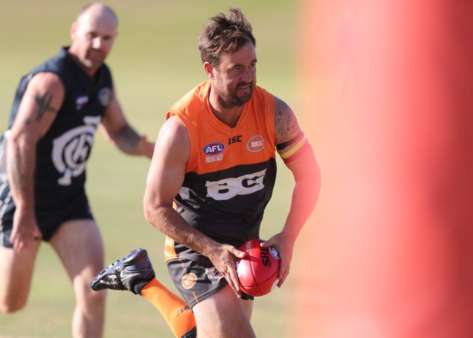 BIG DAY OUT: Bathurst Giants forward Paul Jenkins heads for goal, lining up one of the eight majors he kicked in Saturday's match against Cowra. It took his tally to 25 for the season. Photo: PHIL BLATCH